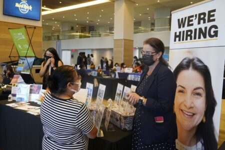 US jobless rate sinks to 3.9% as many more people find jobs