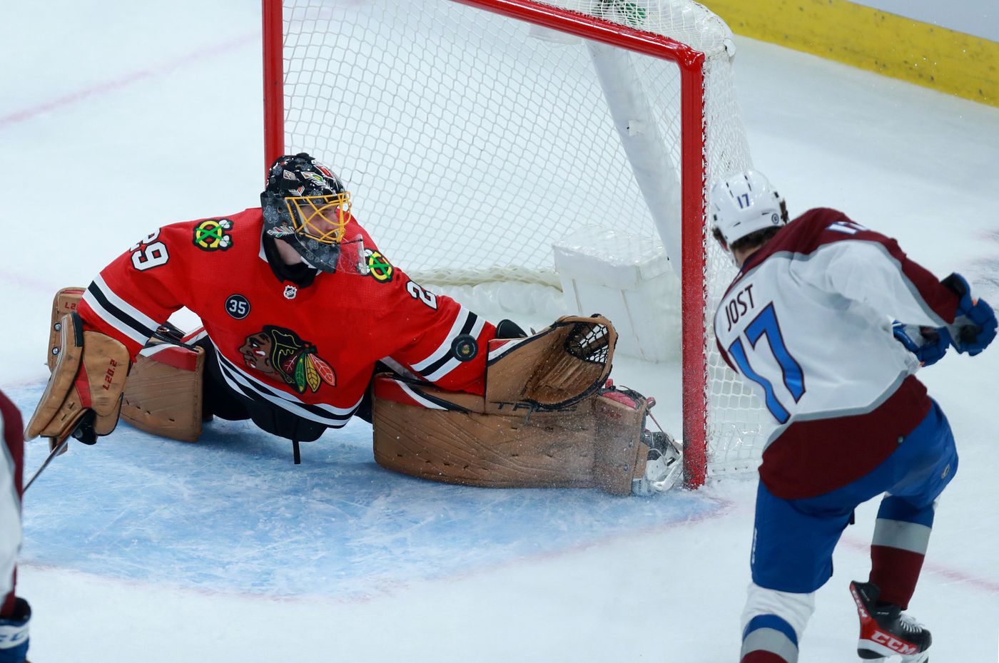 Blackhawks goaltender Marc-André Fleury (29) blocks a shot attempt by Avalanche center Tyson Jost (17) in the first period.
