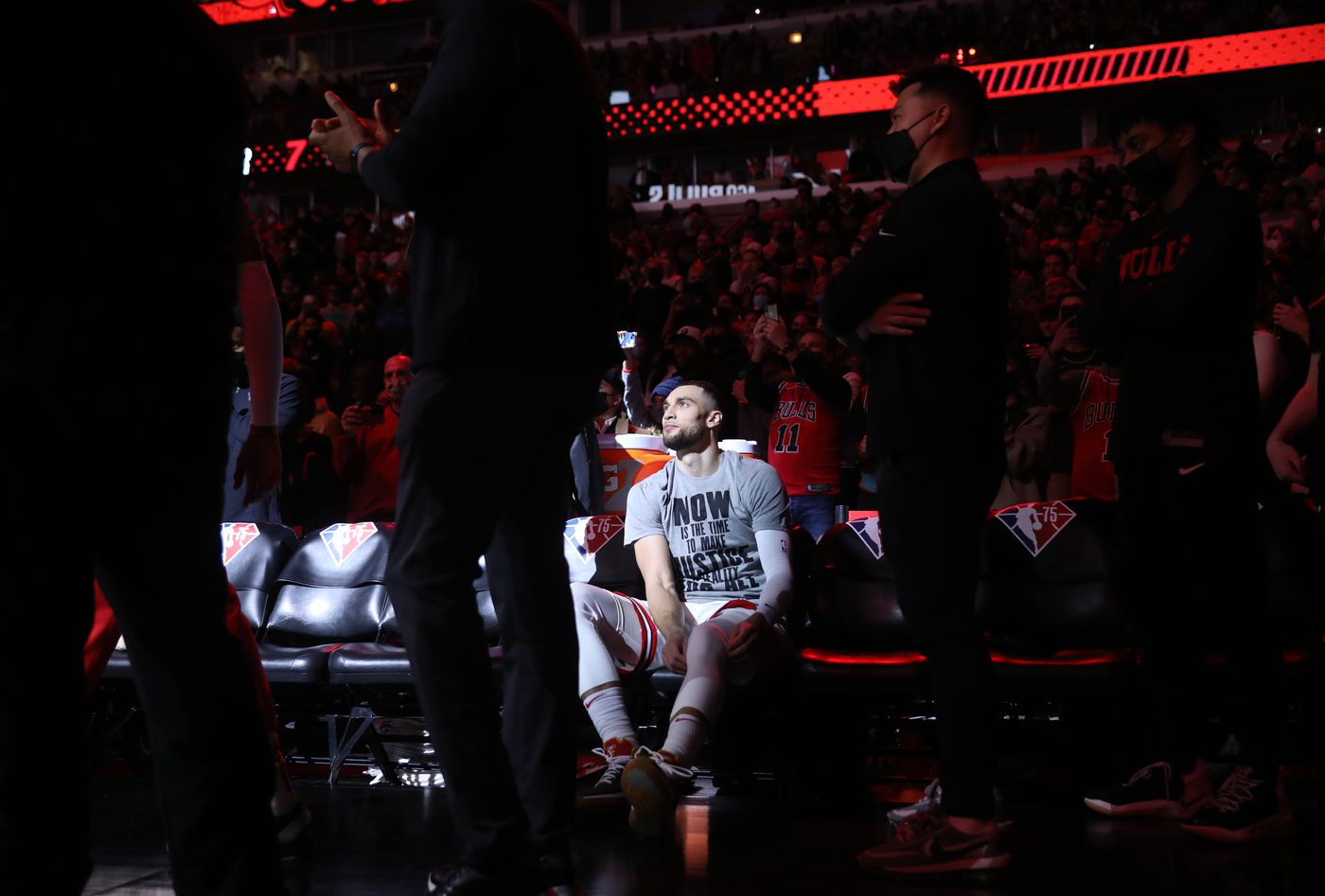 Chicago Bulls guard Zach LaVine (8) sits on the bench before his name is announced for a game against the Golden State Warriors at United Center on Jan. 14, 2022, in Chicago.