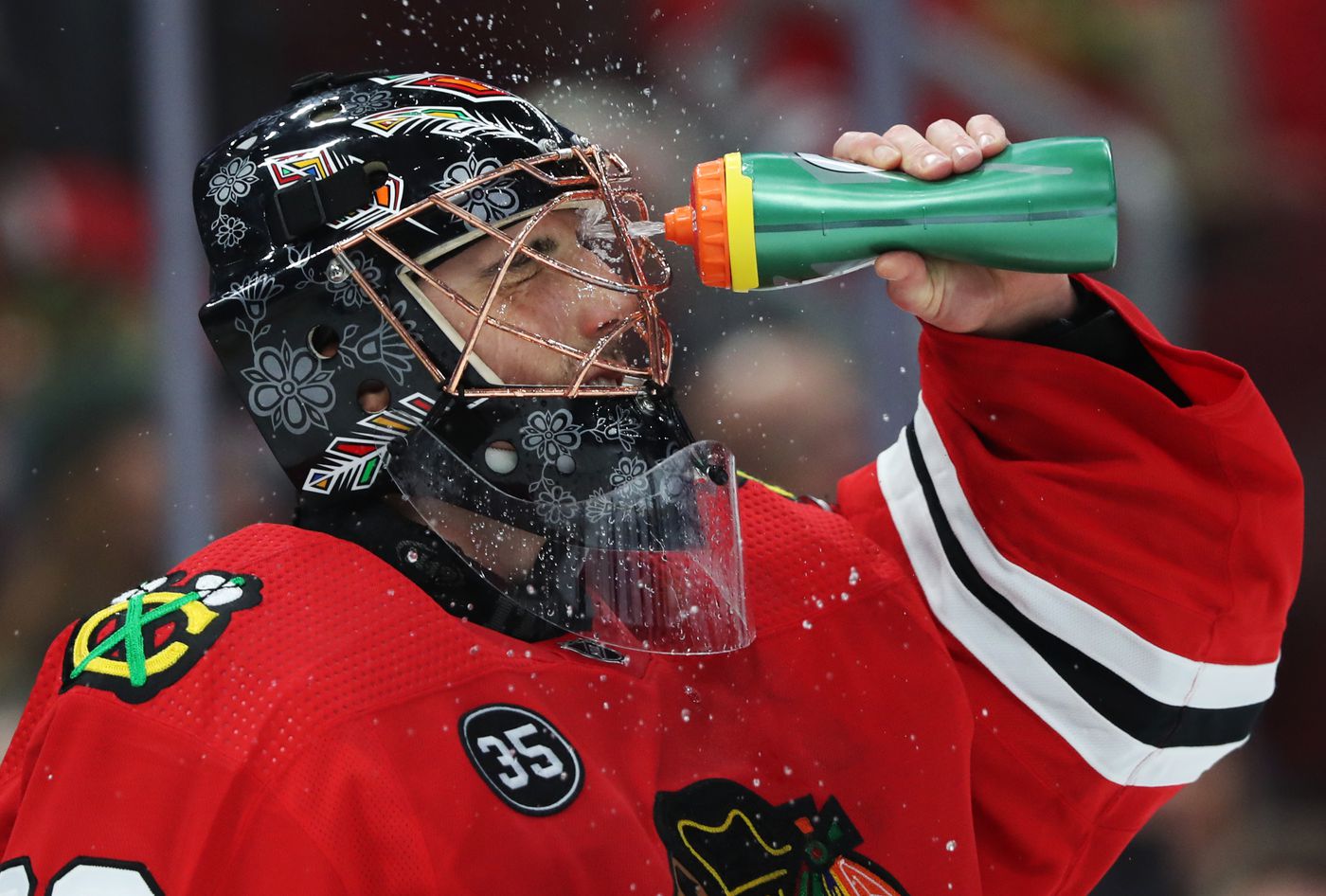 Chicago Blackhawks goaltender Marc-Andre Fleury (29) sprays water on his face during a break in the second period against the Montreal Canadiens at United Center on Jan. 13, 2022, in Chicago.