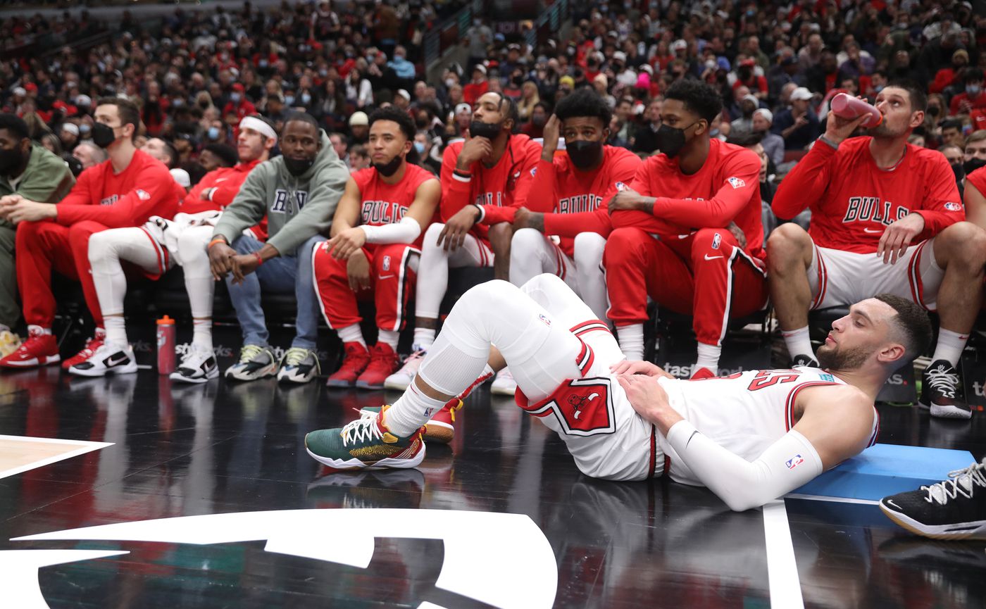 Chicago Bulls guard Zach LaVine (8) stretches on the floor in the third quarter against the Washington Wizards at United Center on Jan. 7, 2022, in Chicago.