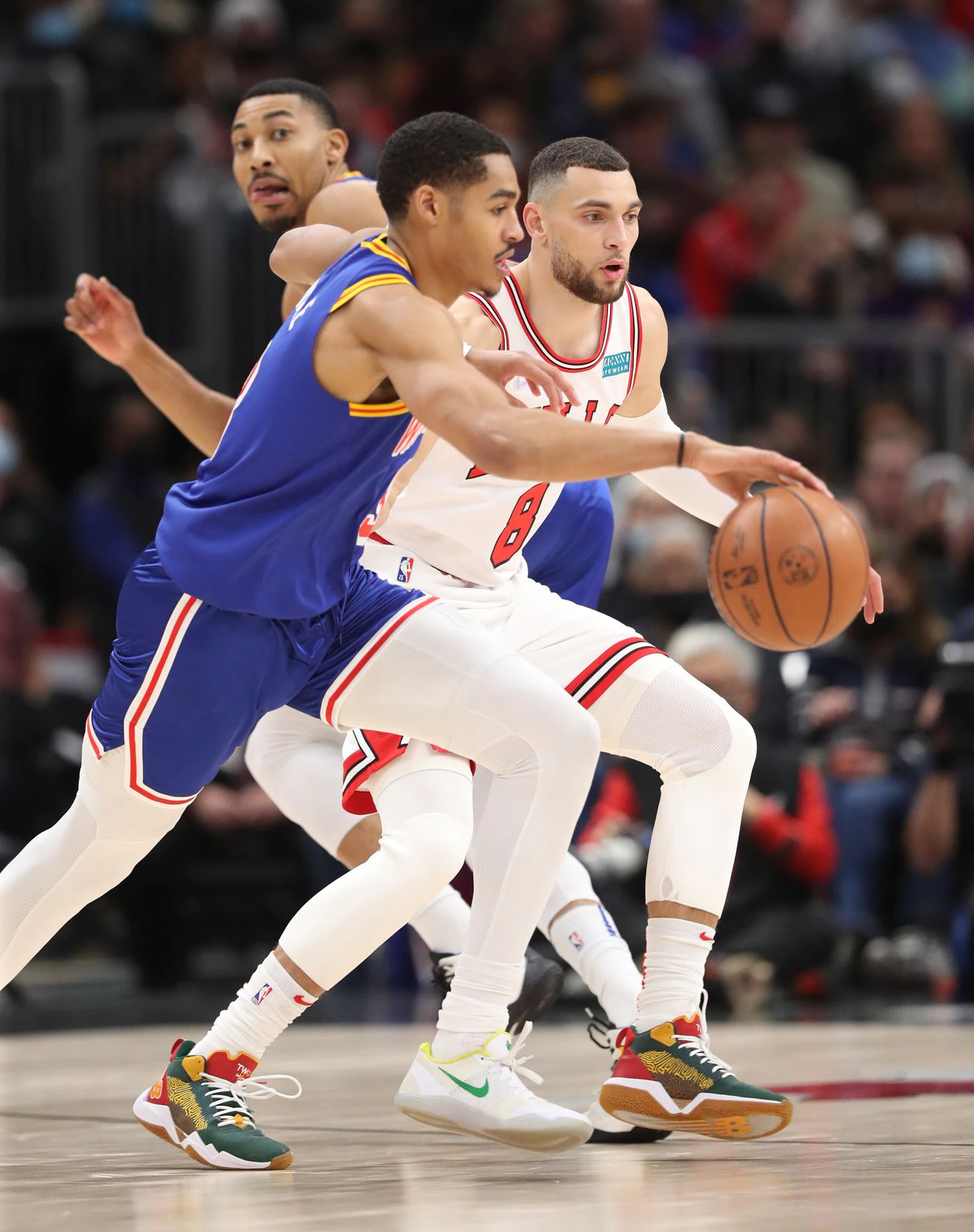 Chicago Bulls guard Zach LaVine (8) defends Golden State Warriors guard Jordan Poole (3) in the first quarter at United Center on Jan. 14, 2022, in Chicago.