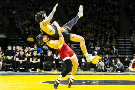 Iowa apologizes to a Wisconsin wrestler who says a fan targeted him with a racial slur