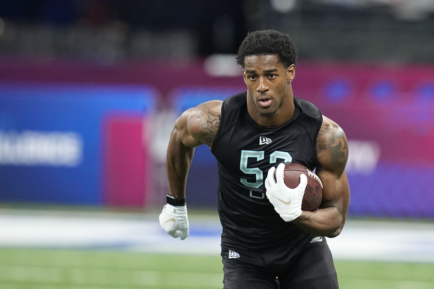 Michigan defensive back Dax Hill runs a drill during the NFL scouting combine on March 6, 2022, in Indianapolis.