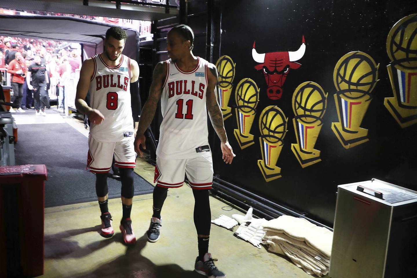 Bulls guard Zach LaVine and forward DeMar DeRozan head to their locker room after losing to the Bucks in the playoffs at the United Center on April 24, 2022.