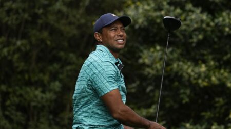 Tiger Woods make the Masters cut but trails runaway leader Scottie Scheffler by 9 heading into the weekend