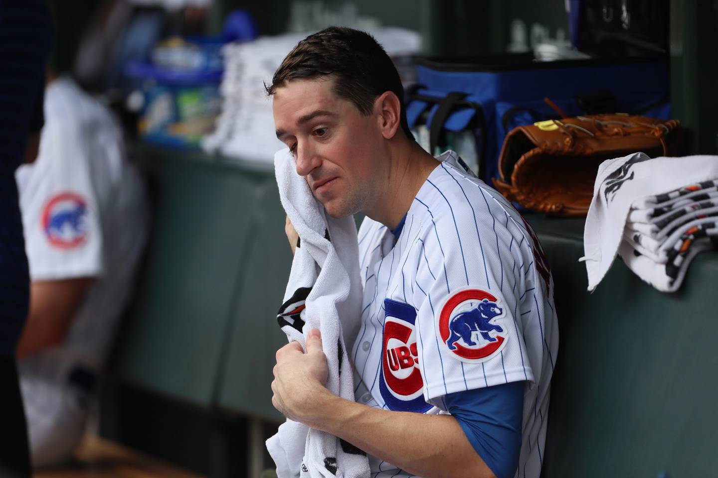 Cubs starting pitcher Kyle Hendricks wipes the sweat from his face during a game against the Cardinals on May 20 at Wrigley Field. 