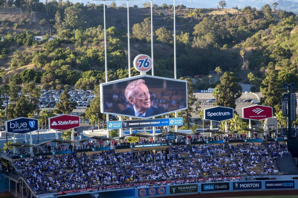 Column: Tributes to Vin Scully remind us of our love for the game — and the voices who became a part of our lives