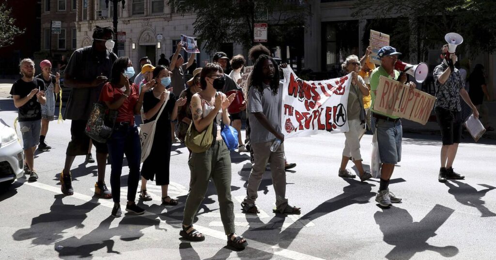 ‘Evictions’ from Uptown encampment at luxury development site leads to march, arrests during protest, activists say