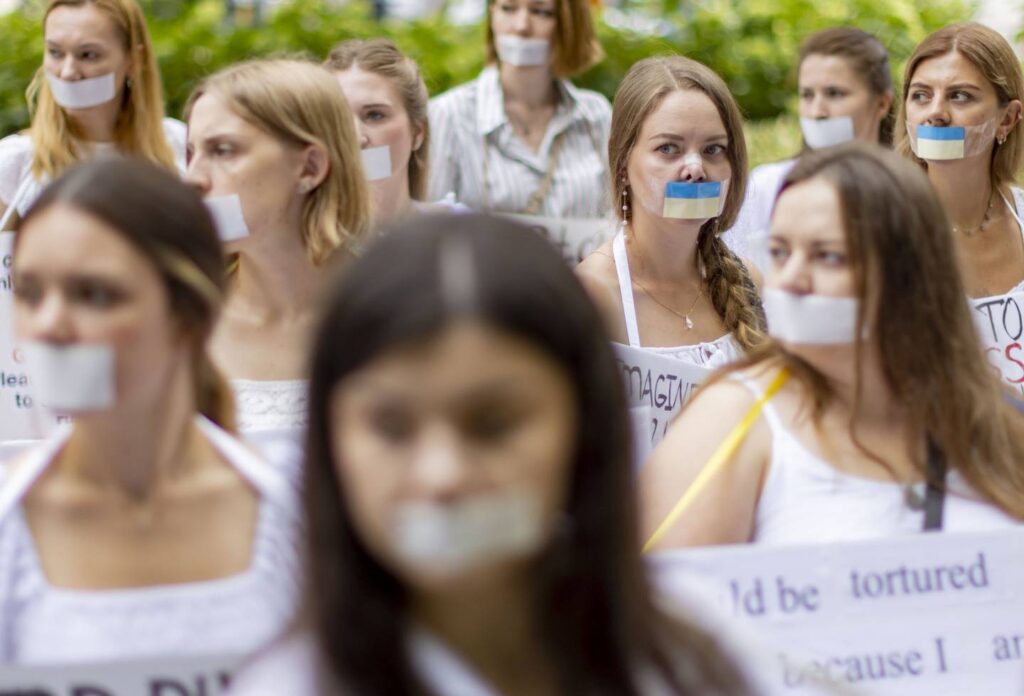 Hundreds of women take stand against Russia in silent protest downtown
