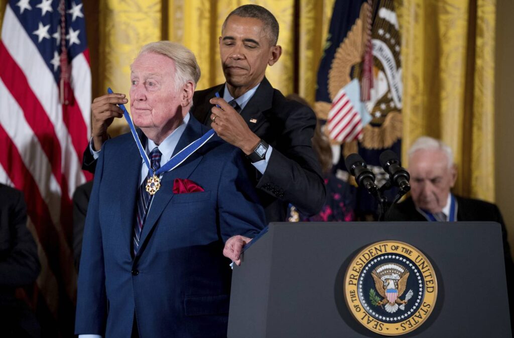 Vin Scully dies at 94. The Hall of Fame broadcaster called Dodgers games for 67 years.