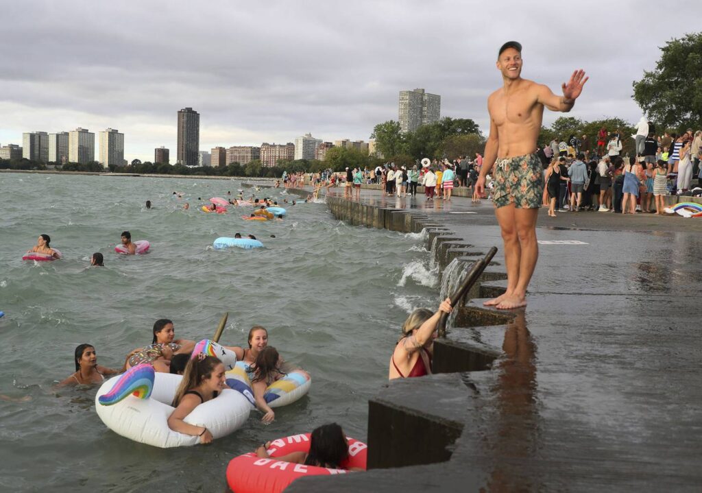 Friday Morning Swim Club brings hundreds of people to Montrose Harbor for morning dip and coffee. ‘It’s just joy,’ organizer says.