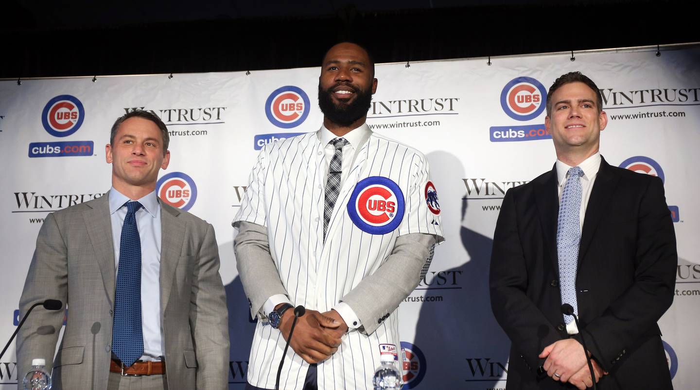 Cubs general manager Jed Hoyer, left, and team President Theo Epstein, right, introduce outfielder Jason Heyward at a news conference on Dec. 15, 2015, at Spiaggia restaurant in Chicago. 