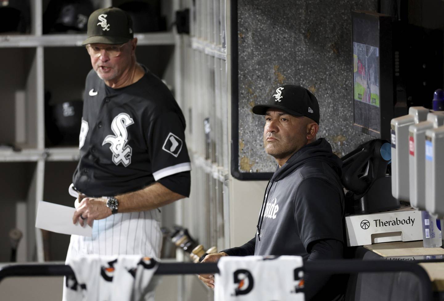 White Sox acting manager Miguel Cairo, right, looks out from the dugout before a game against the Guardians on Wednesday at Guaranteed Rate Field. 