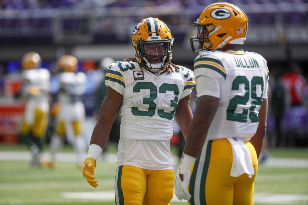 Aaron Rodgers says the Green Bay Packers should have stuck with the running game longer in their opening loss