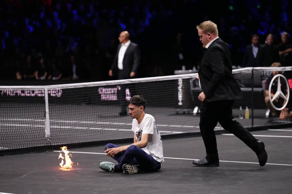 Protester at Laver Cup sets the court and his arm on fire
