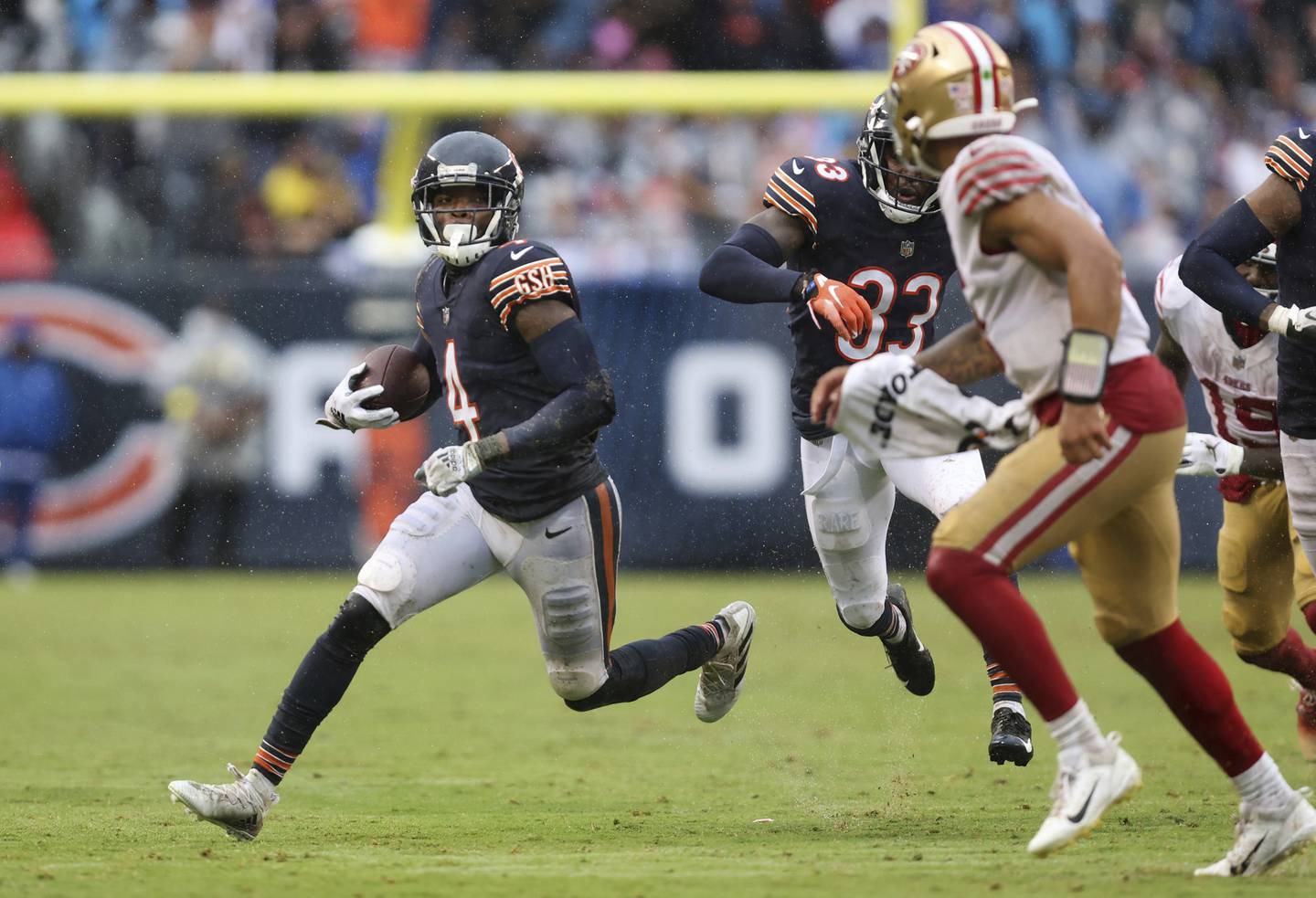 Bears safety Eddie Jackson (4) runs back an interception in the fourth quarter against the 49ers on Sept. 11, 2022, at Soldier Field. 