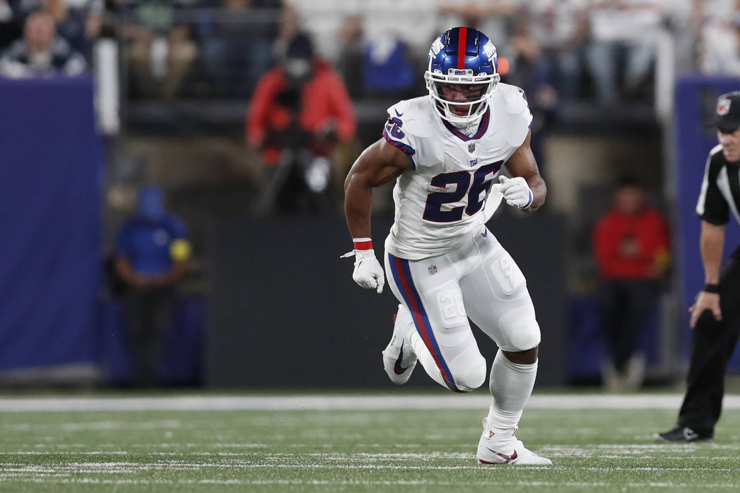 Giants running back Saquon Barkley runs a route during a game on Sept. 26, 2022.
