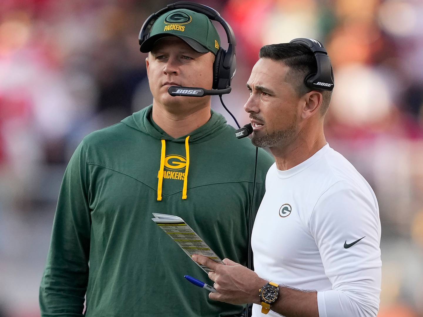 Packers quarterbacks/passing game coordinator Luke Getsy, left, and coach Matt LaFleur talk during a game against the 49ers on Sept. 26, 2021, in Santa Clara, Calif.