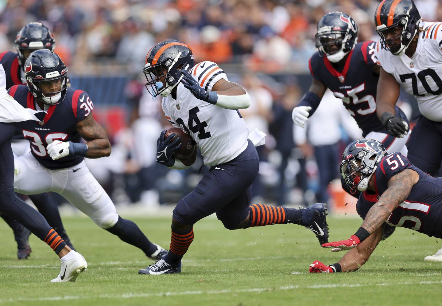 Bears running back Khalil Herbert (24) makes a move in the second quarter against the Texans on Sunday at Soldier Field. 