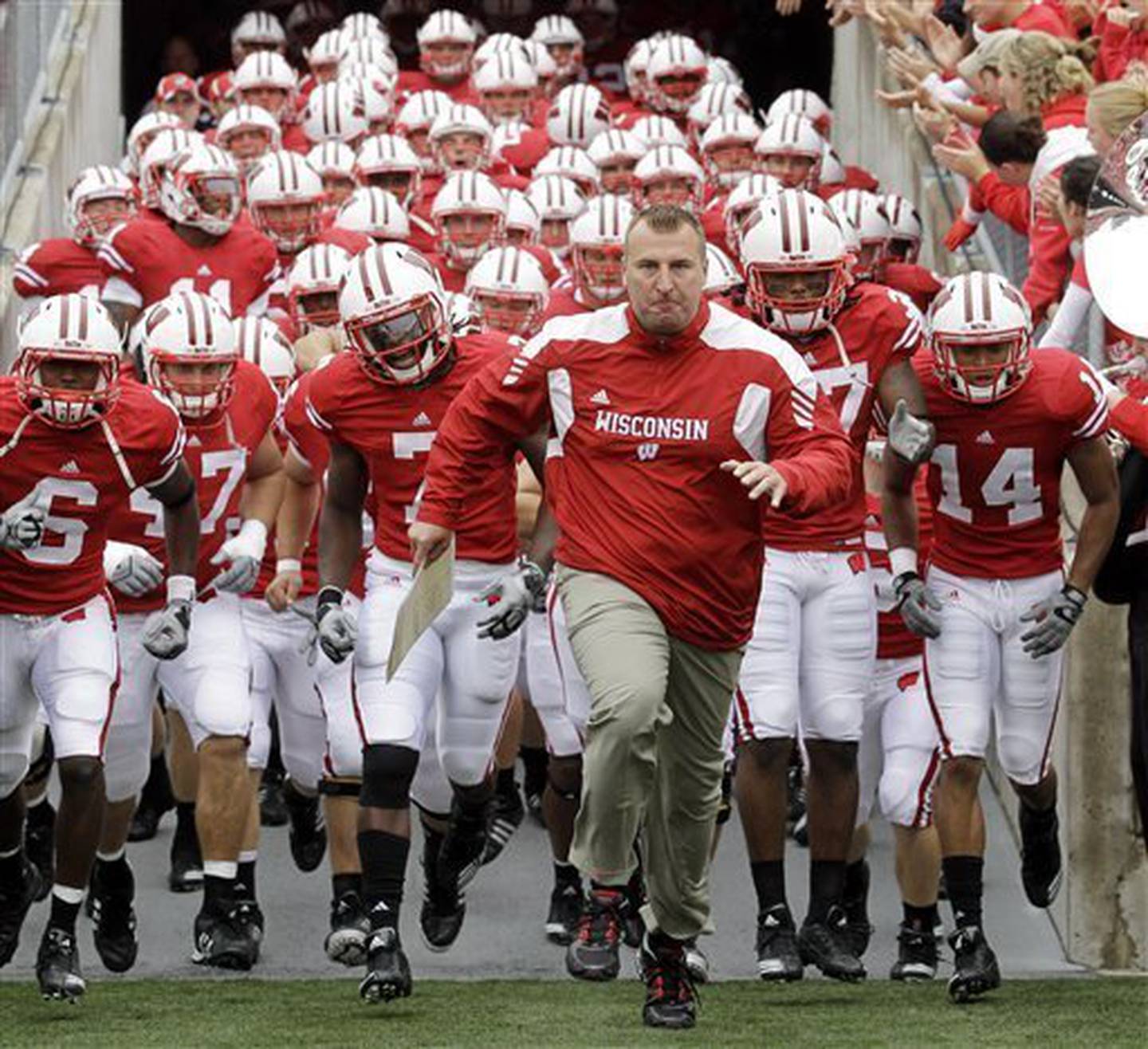 Wisconsin coach Bret Bielema leads his team onto the field before a game against San Jose State on Sept. 11, 2010, in Madison, Wis.
