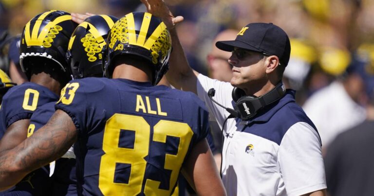 Michigan coach Jim Harbaugh hopes players get a revenue share from 12-team College Football Playoff