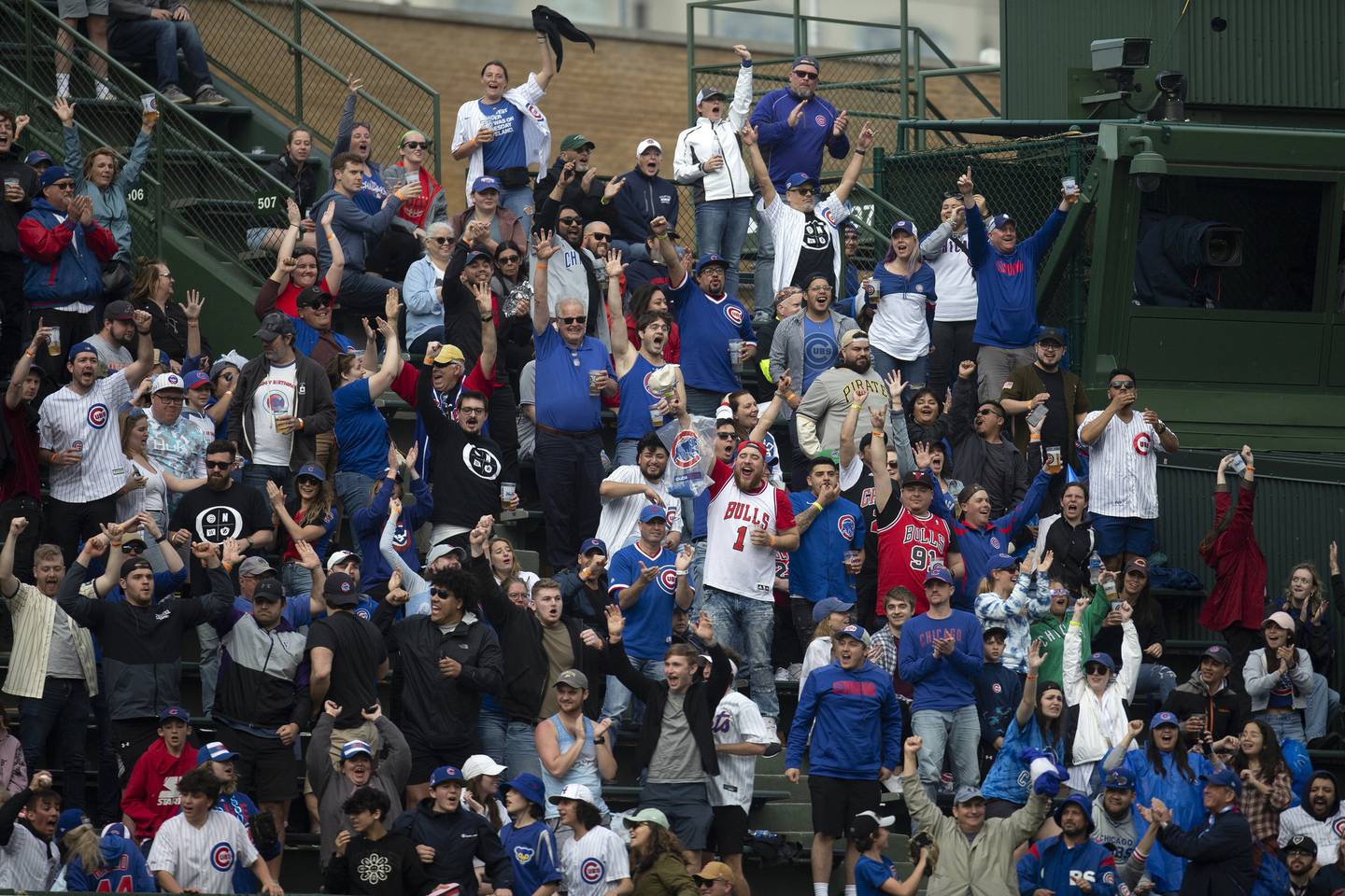 Fans cheer after Cubs center fielder Ian Happ hit a home run against the Pirates on April 24 at Wrigley Field. 
