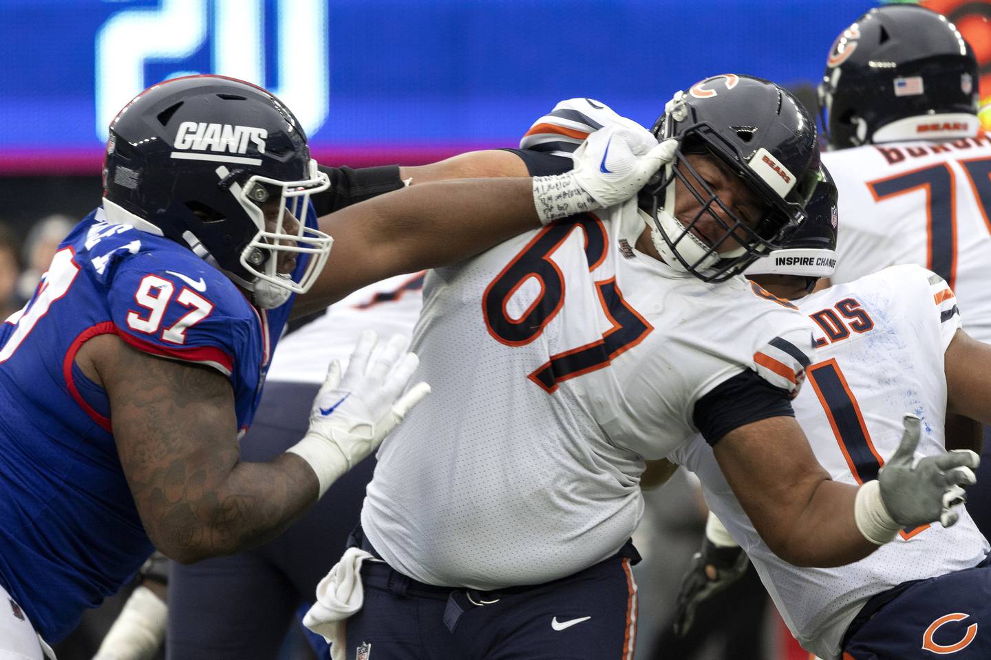 Giants defensive tackle Dexter Lawrence grabs the jersey of Bears center Sam Mustipher during the fourth quarter of the game on Oct. 12, 2022.
