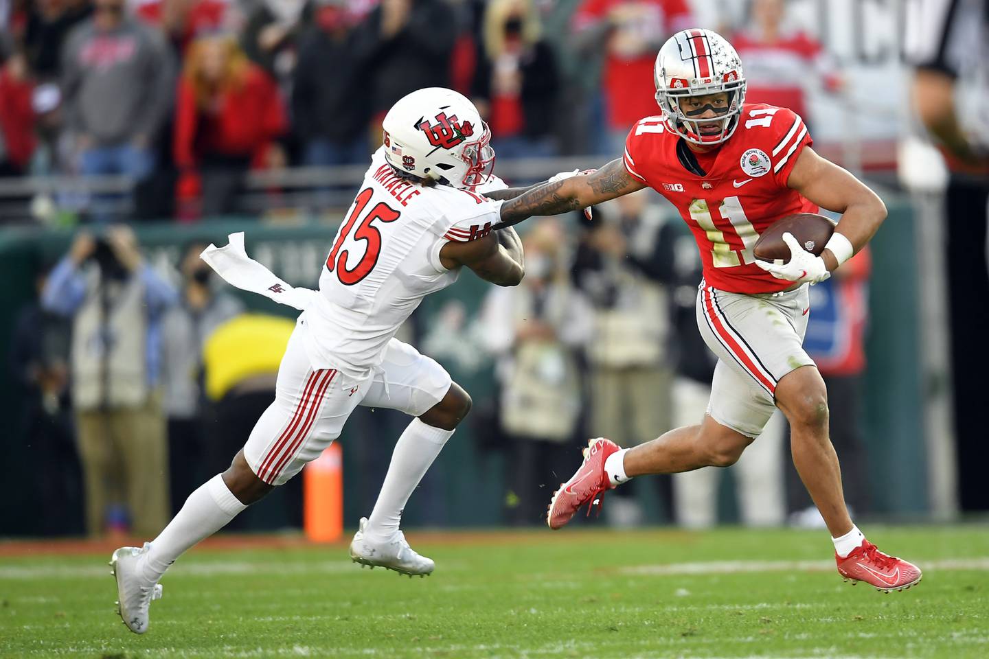 Ohio State wide receiver Jaxon Smith-Njigba runs past Utah cornerback Malone Mataele during the Rose Bowl on Jan. 1, 2022, in Pasadena, Calif.