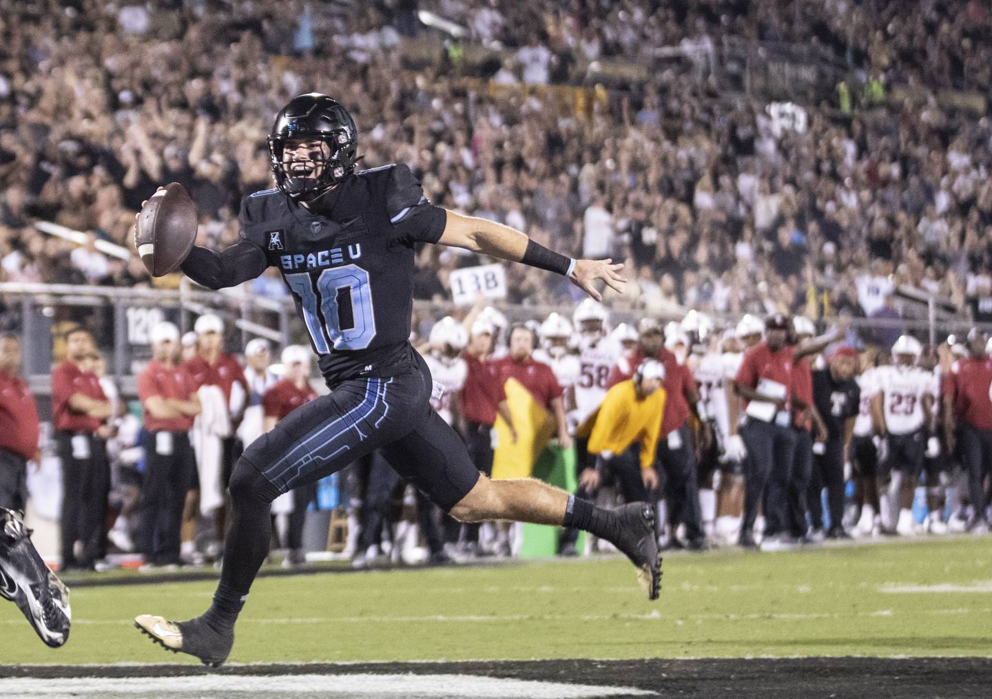 UCF quarterback John Rhys Plumlee fakes the pass and runs in for a touchdown during a win over Temple on Oct. 13.