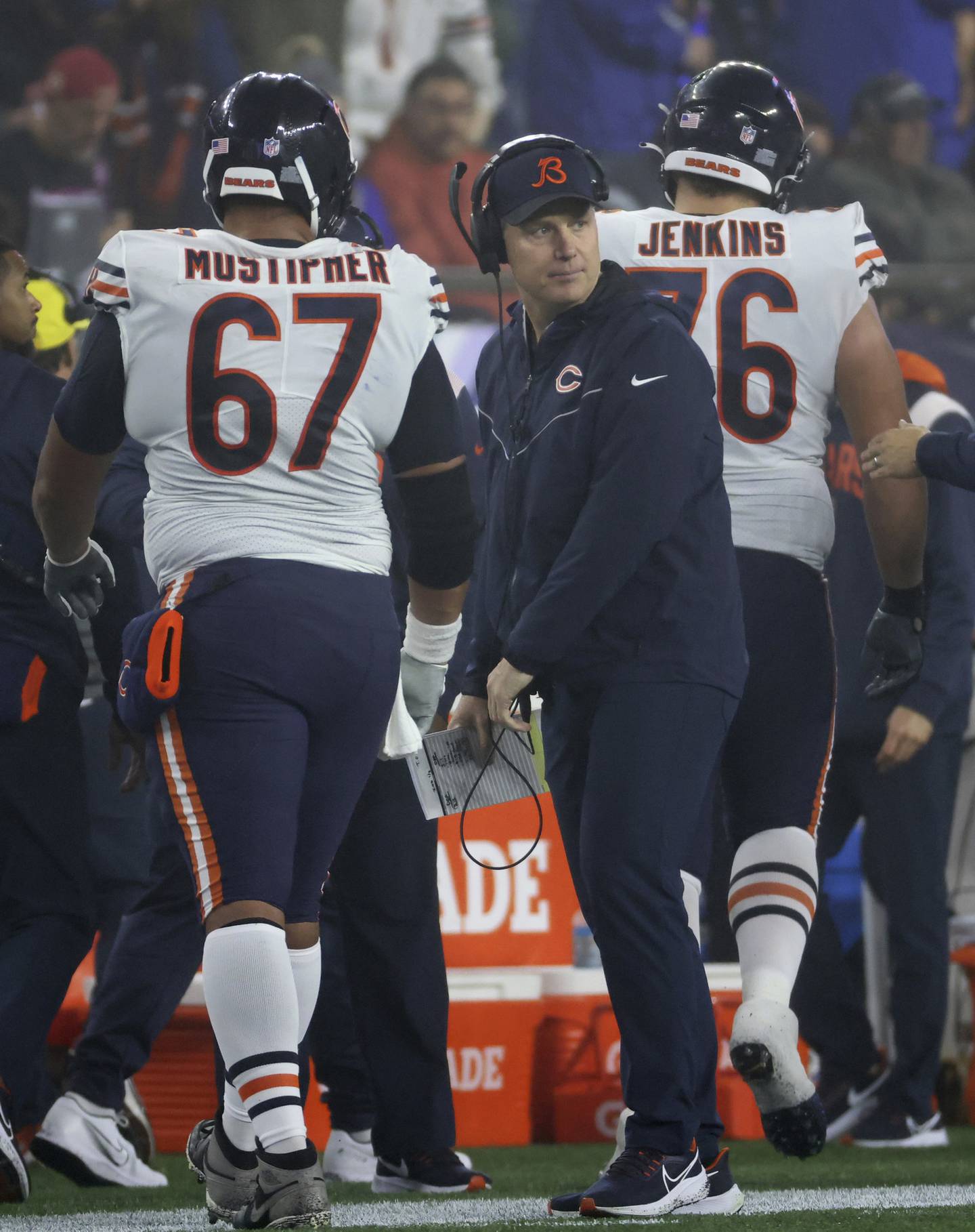 Bears coach Matt Eberflus looks to the field after watching center Sam Mustipher and offensive tackle Teven Jenkins head to the sideline after an offensive drive in the third quarter against the Patriots at Gillette Stadium on Oct. 24, 2022.