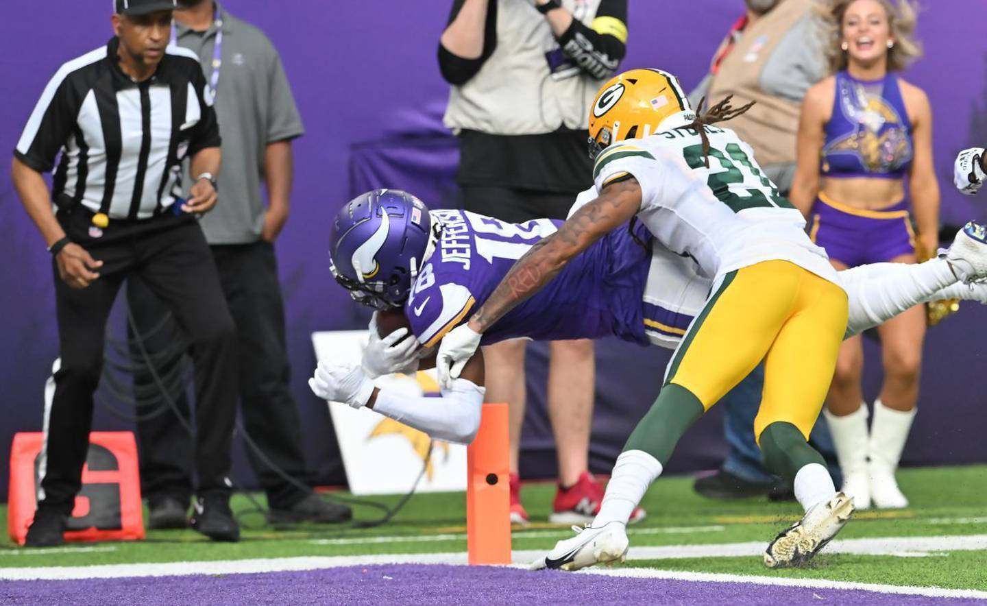 Vikings wide receiver Justin Jefferson dives into the end zone against Packers cornerback Eric Stokes for his second touchdown of the game on Sept. 11, 2022, at U.S. Bank Stadium in Minneapolis. 