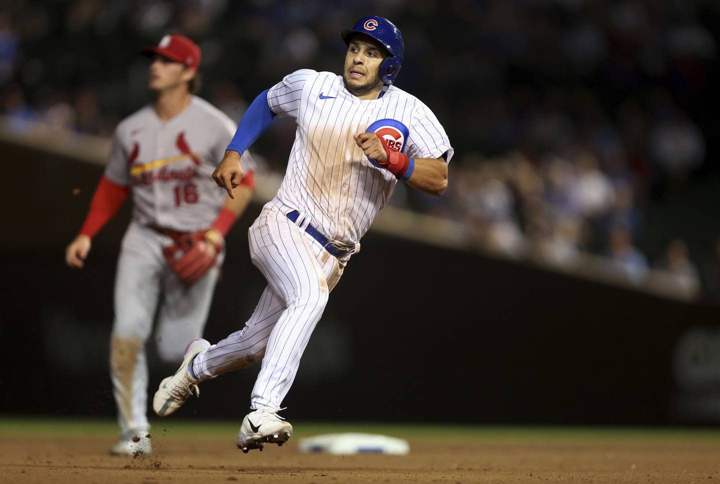 Nick Madrigal sprints around the bases before scoring a run on a double by Rafael Ortega in the sixth inning of a game against the StCardinals at Wrigley Field on Aug. 23, 2022.