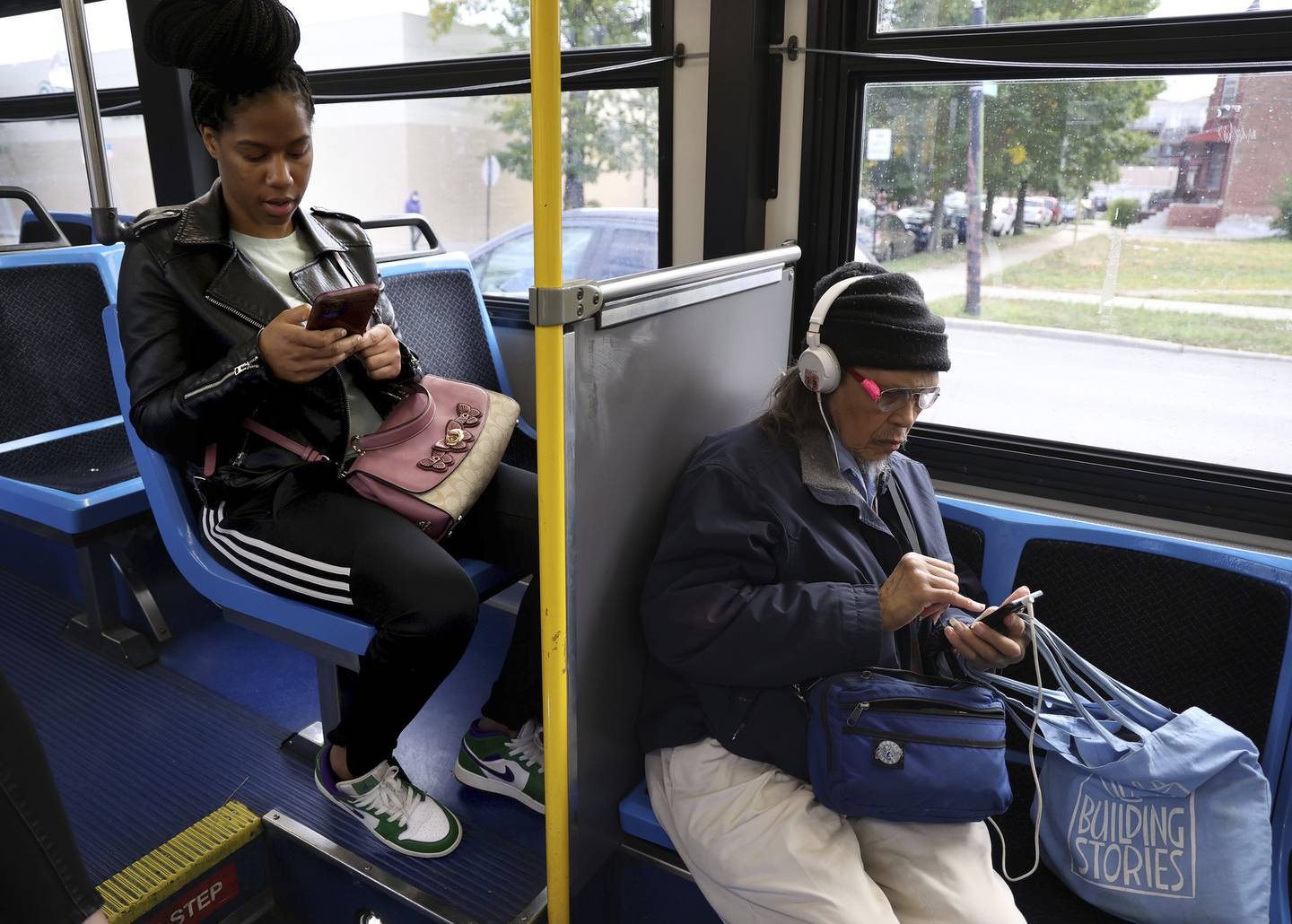 Passenger Angela Jackson, left, rides a CTA #4 Cottage Grove bus after dropping off her son at school on Oct. 6, 2022. 