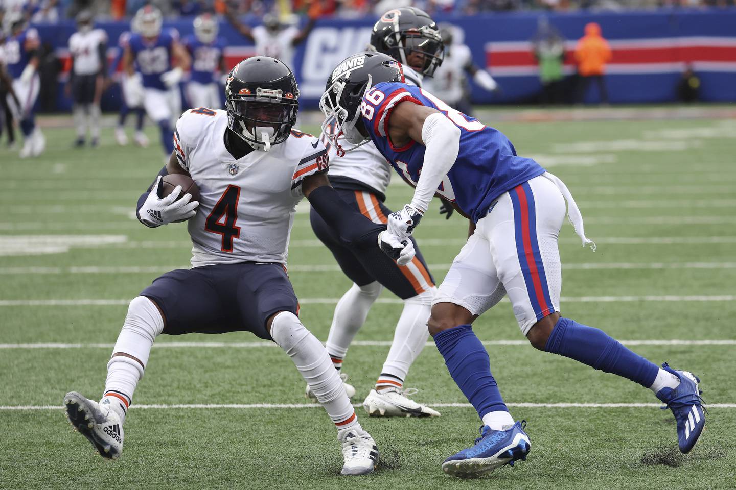 Bears safety Eddie Jackson runs with the ball against the Giants' Darius Slayton after making an interception during the fourth quarter Sunday at MetLife Stadium in East Rutherford, N.J. 
