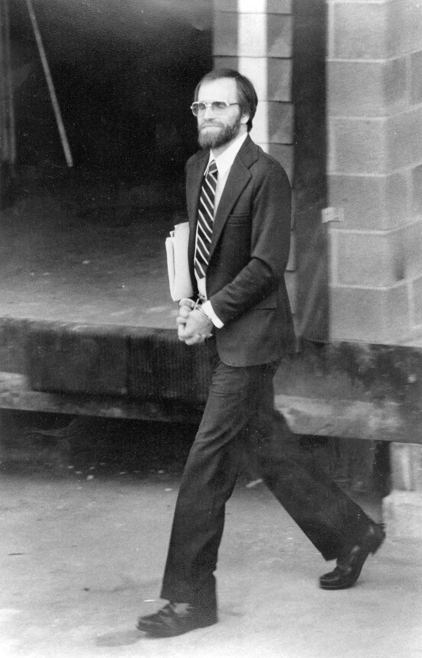 In this July 12, 1983, photo, James Lewis leaves a federal court in Kansas City, Missouri, where he was convicted of mail fraud. 