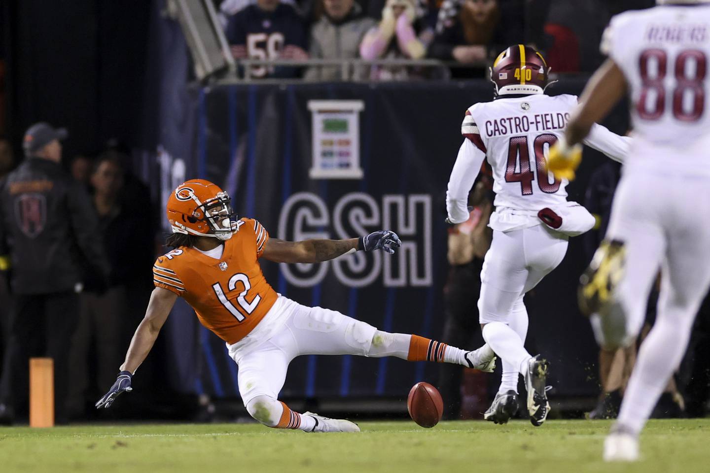 Bears wide receiver Velus Jones Jr. (12) muffs a punt during the fourth quarter against the Commanders on Thursday at Soldier Field. 