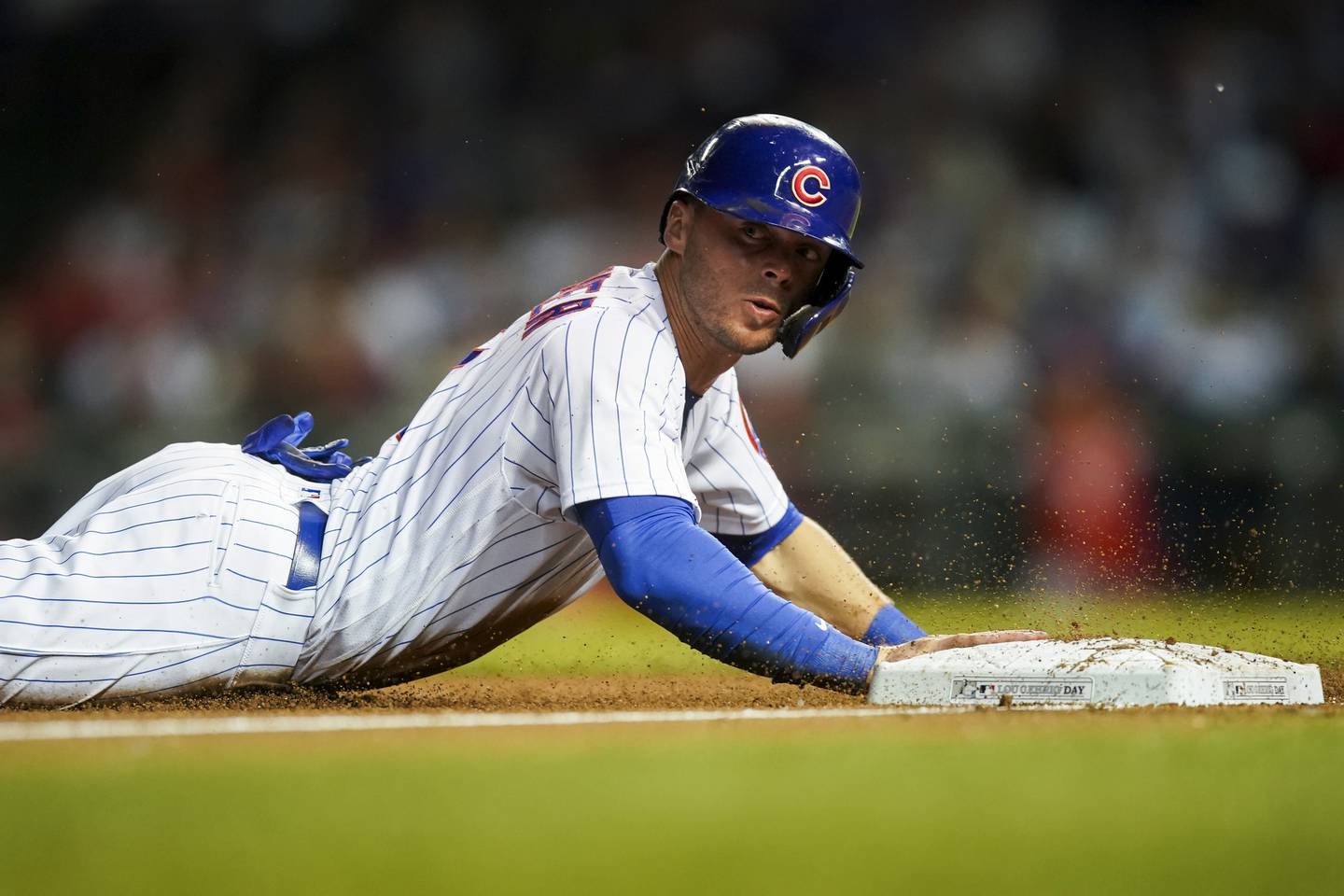 Cubs shortstop Nico Hoerner slides safely into third base during a game against the Cardinals on June 2 at Wrigley Field. 