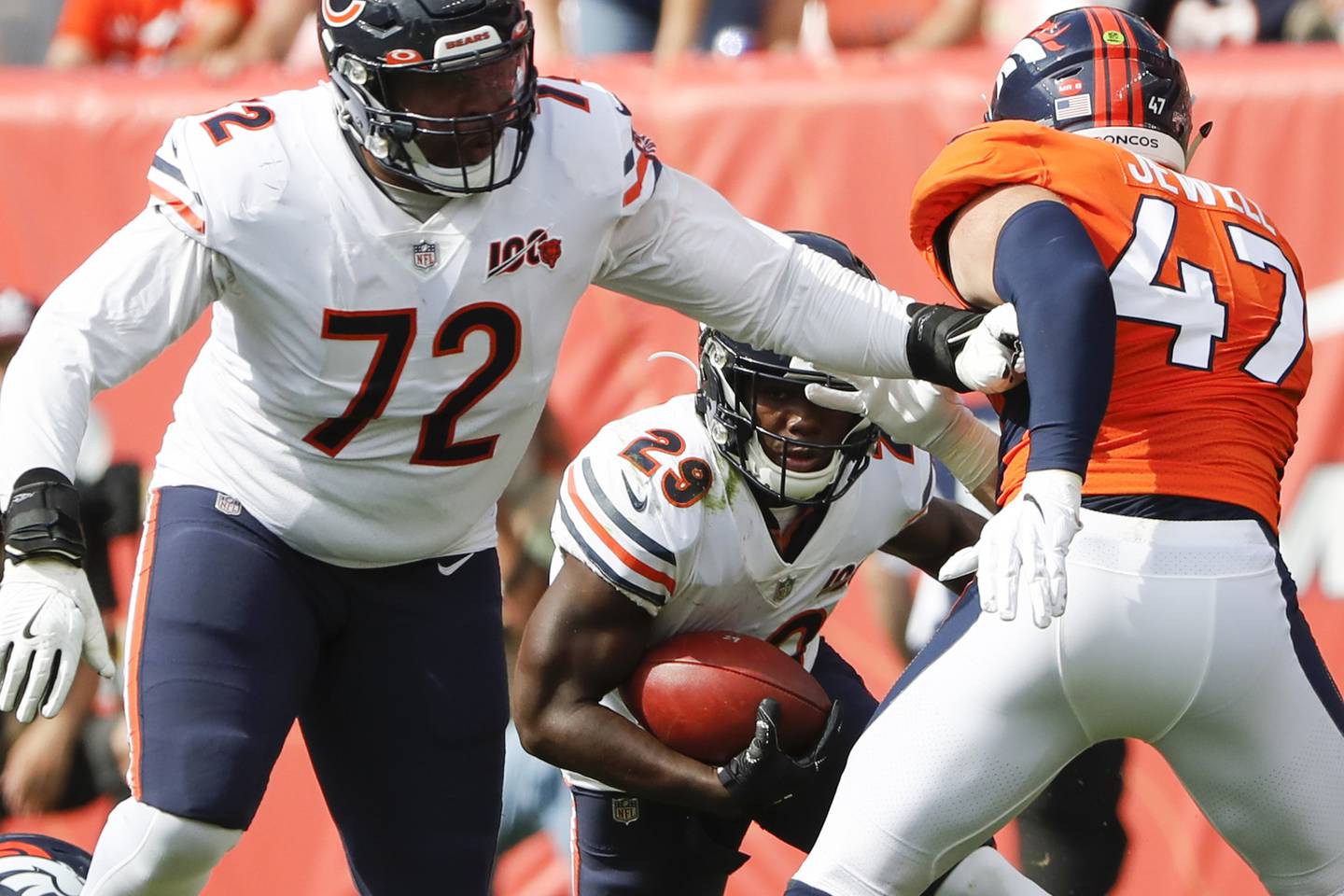Chicago Bears running back Tarik Cohen (29) runs behind Chicago Bears offensive tackle Charles Leno (72) in the second quarter as Denver Broncos inside linebacker Josey Jewell (47) defends at Broncos Stadium at Mile High in Denver on Sunday, Sept. 15, 2019. (Jose M. Osorio/Chicago Tribune)