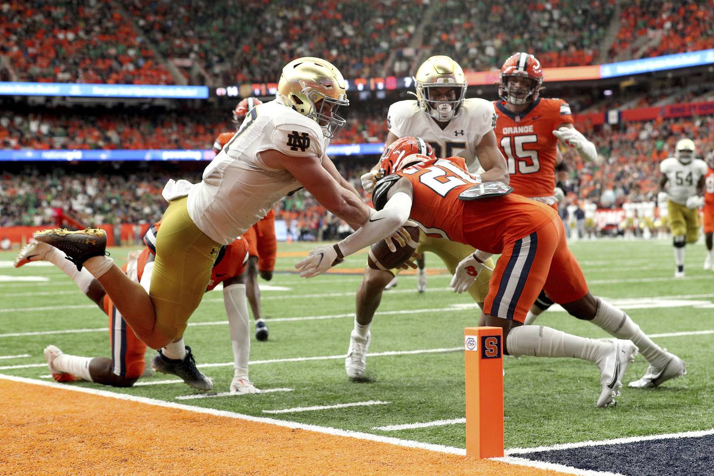 Notre Dame tight end Michael Mayer is tackled by Syracuse's Isaiah Johnson just shy of the end zone during the second quarter Saturday in Syracuse, N.Y. 