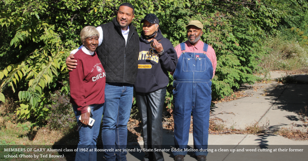 Gary Theodore Roosevelt alumni pull weeds to beautify school grounds