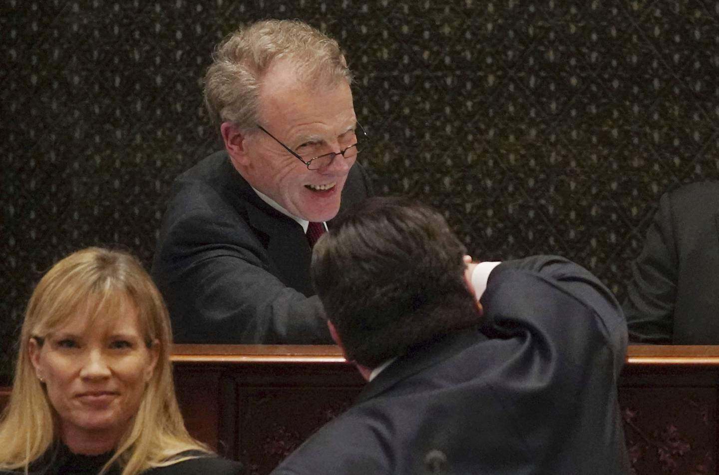 House Speaker Michael Madigan faces and congratulates Gov. J.B. Pritzker after his first budget address at the Illinois State Capitol in Springfield on Feb. 20, 2019. 