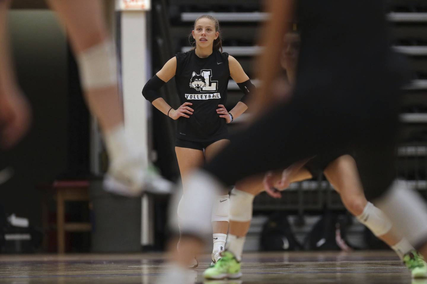 Loyola University Chicago volleyball player Grace Hinchman watches practice at Gentile Arena on Oct. 18, 2022. Hinchman was diagnosed with a rare epilepsy condition called FIRES, febrile infection-related epilepsy syndrome. The condition affects about 1 in 1,000,000 people.