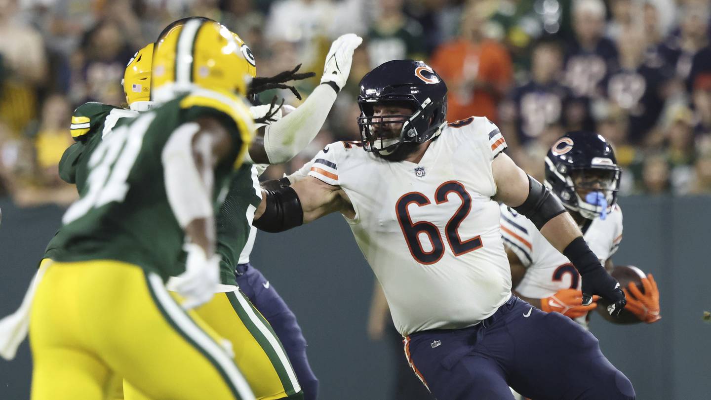 Bears guard Lucas Patrick (62) works to keep Packers defenders from running back Khalil Herbert in the fourth quarter on Sept. 18, 2022, at Lambeau Field. 