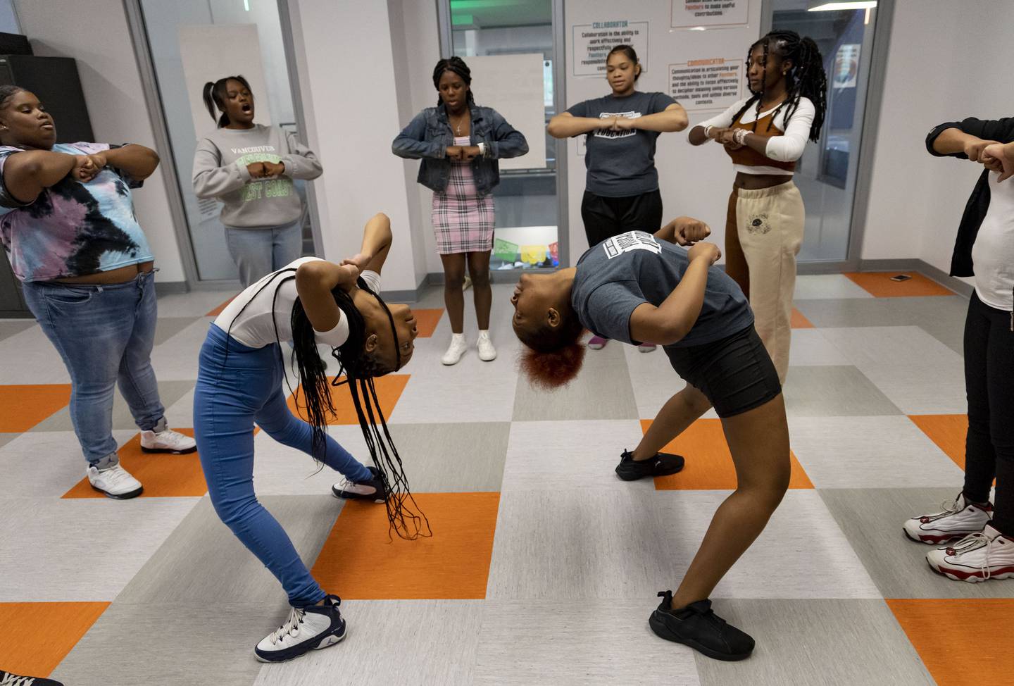 Seniors Jaeda Buchanan, left, and Myeela Rogers rehearse a routine with the step team on Oct. 5, 2022, during an after-school program at Englewood STEM High School. 