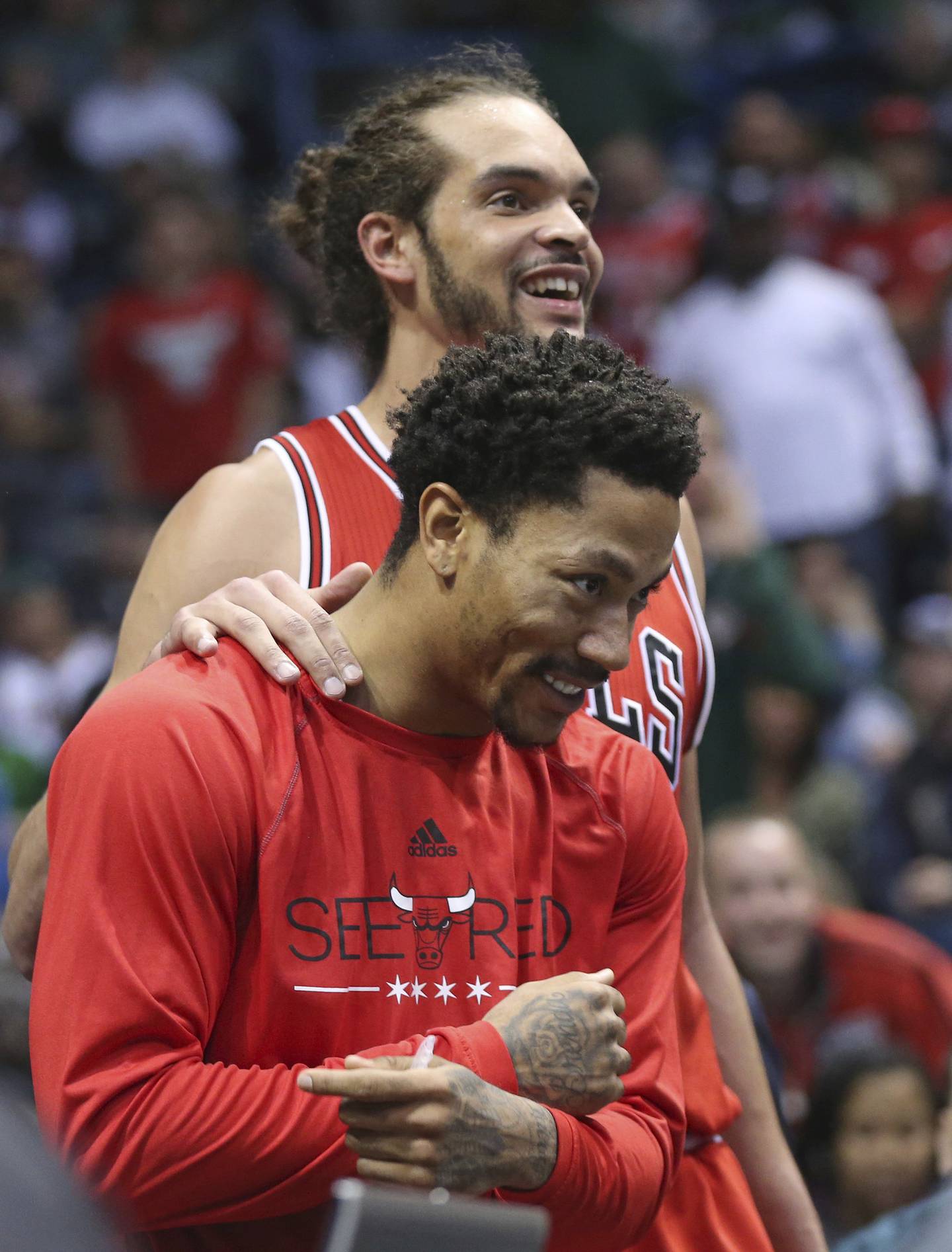 Joakim Noah and Derrick Rose smile in the final minutes of a Bulls playoff game on April 30, 2015.