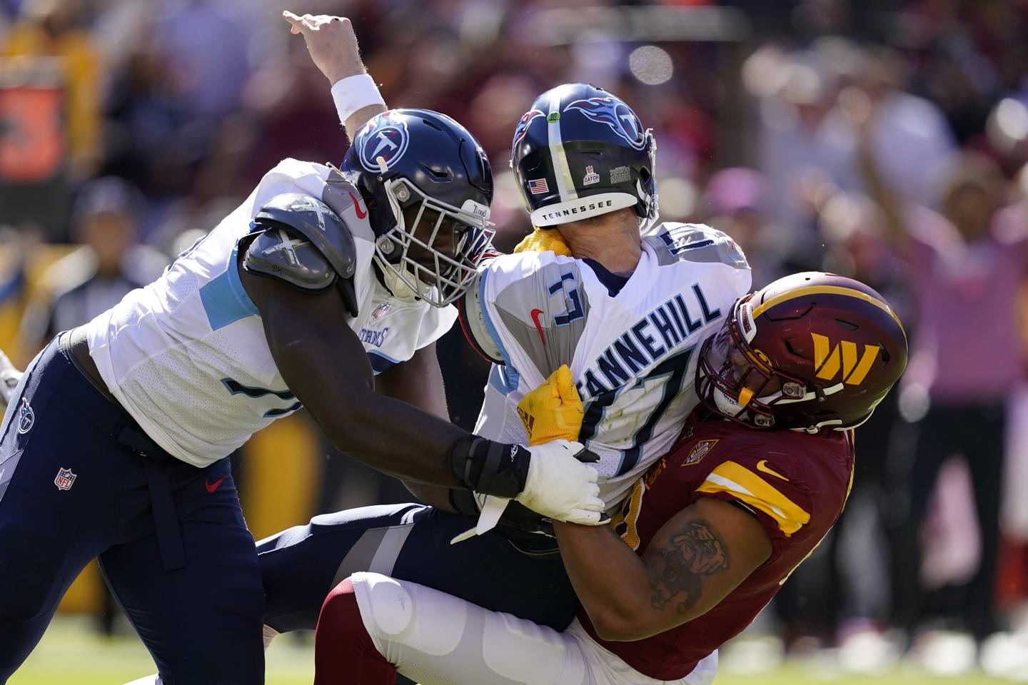 Commanders defensive end Montez Sweat tackles Titans quarterback Ryan Tannehill on Oct. 9, 2022, in Landover, Md.