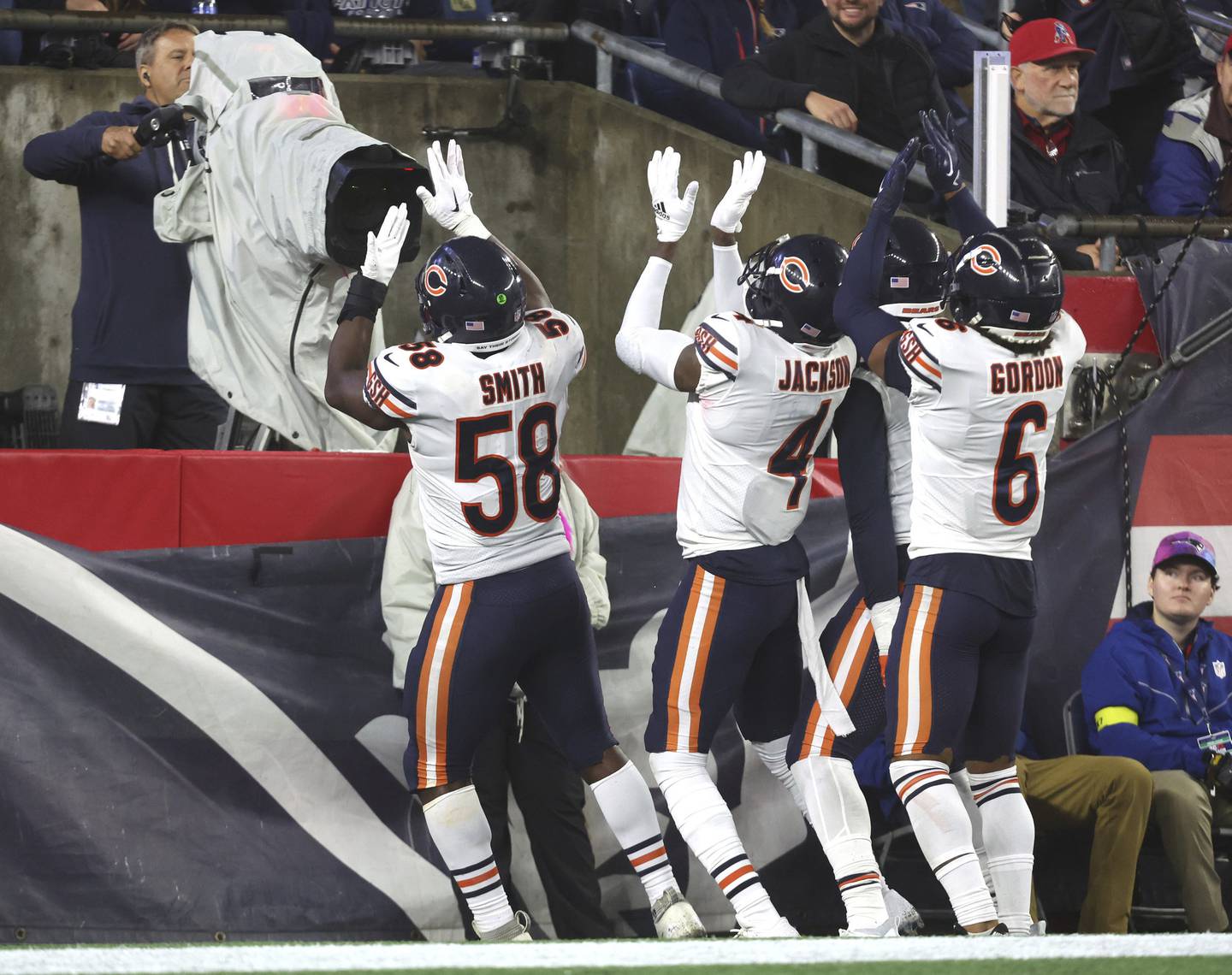 Bears linebacker Roquan Smith (58), safety Eddie Jackson (4) and cornerback Kyler Gordon (6) celebrate after an interception by Smith in the fourth quarter against the Patriots on Monday, Oct. 24, 2022, at Gillette Stadium in Foxborough, Mass.