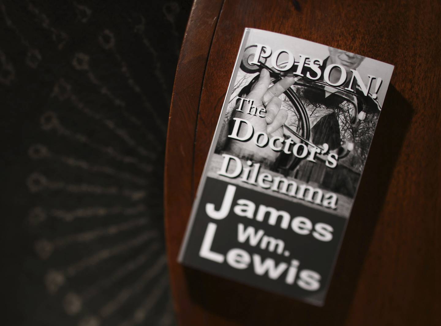 “Poison! The Doctor’s Dilemma” is a self-published 2010 novel by James Lewis about a brilliant doctor from rural Missouri who works with law enforcement.