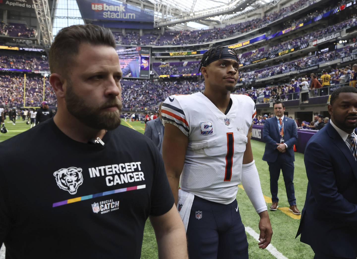Bears quarterback Justin Fields (1) walks off the field after a 29-22 loss to the Vikings on Sunday, Oct. 9, 2022, in Minneapolis.